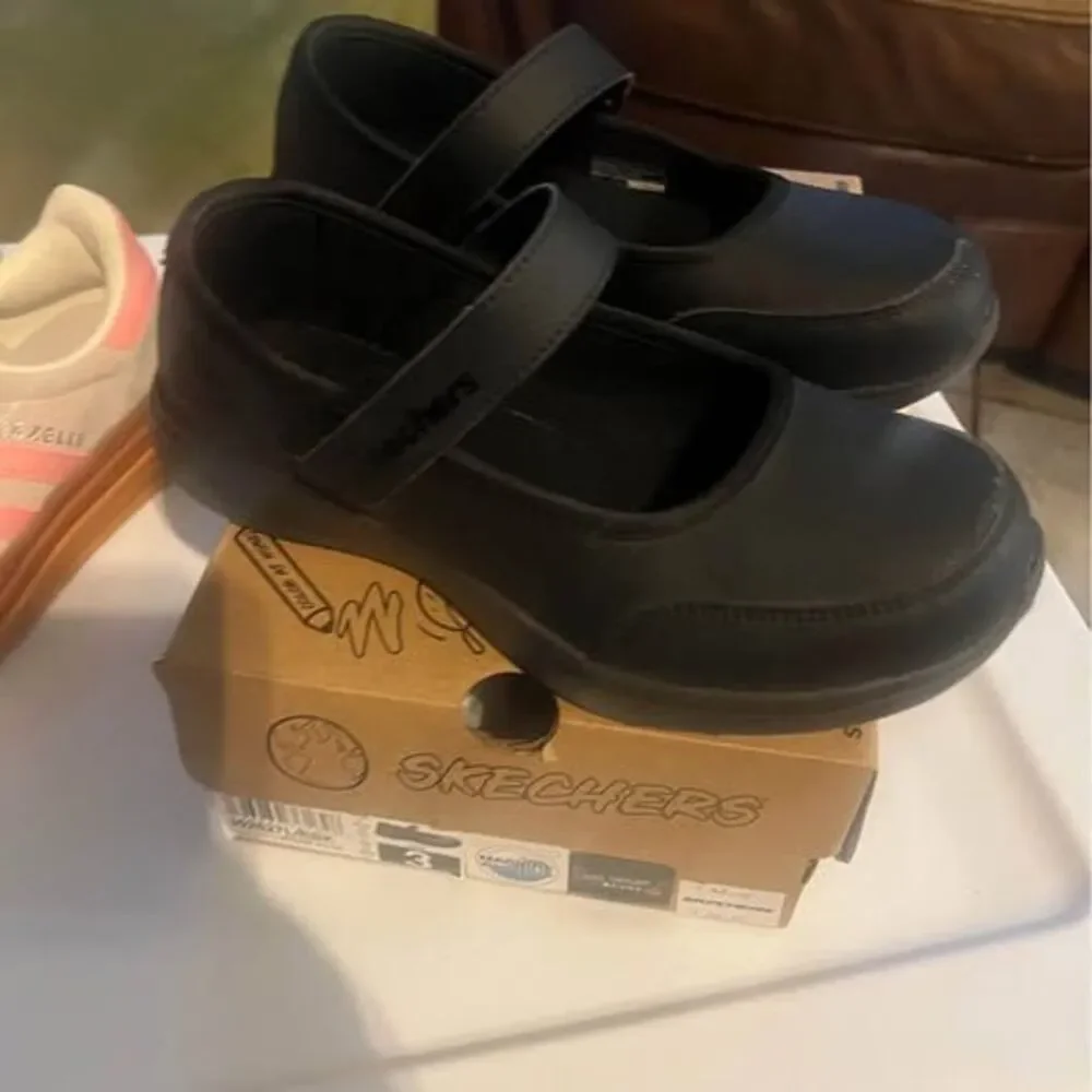 Uniform black sketcher shoes size 3